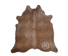 a brown and black animal print cowhide rug