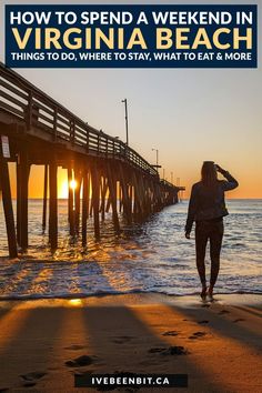 a woman walking on the beach next to a pier at sunset with text overlay how to spend a weekend in virginia beach things to do, where to stay, what to eat and more