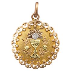 We are delighted to introduce this lovely 18 ct pinkish yellow gold patina medal featuring a chalice, which is a cup often use for drinking during a religious ceremony. A host marked with the letters JHS and a cross is sparkling above it. This antique pendant is flanked with a very detailled floral border and adorned with hand made engravings and rose gold scrolls. This royal charm is hallmarked with an eagle head. The back of this marvellous charm is engraved with the date 9 june 1892 and the l Engraved Flower, Art Nouveau Pendant, Religious Ceremony, Rose Gold Charms, Antique Pendant, Antique Necklace, Floral Border, Horse Head, Rare Antique