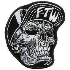 a black and white patch with a skull wearing a hat on it's head