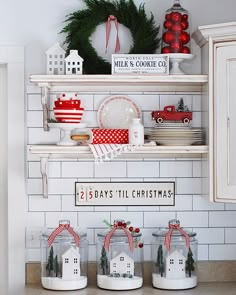 a kitchen with christmas decorations on the shelves