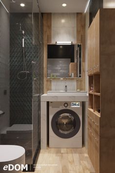 a washer sitting inside of a bathroom next to a walk in shower