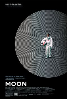 a man standing in front of a black and white poster with the words moon on it