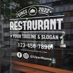 a restaurant sign on the glass door of a building