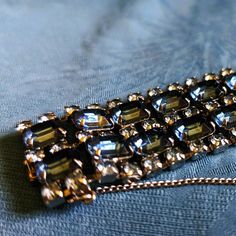 6 3/4" long, 1 1/4" wide. 30 large, blue Rhinestones lined with 87 light blue smaller Rhinestones.  It really is a glittering showpiece. Something Marilyn Monroe would wear in "Gentlemen Prefer Blondes". or "Diamonds Are A Girls Best Friend".  Comes in a bracelet box with a clasp and a mirror on the inside lid. Gentlemen Prefer Blondes, Bracelet Box, Wide Bracelet, Wedding Jewelry Bracelets, Blue Rhinestones, Wedding Bracelet, Girls Best Friend, Denim Blue, Marilyn Monroe