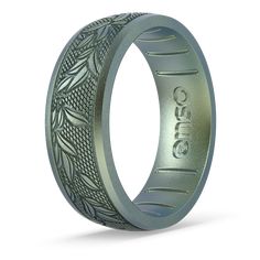 a wedding band with an intricate design on the outside and inside, made from stainless steel