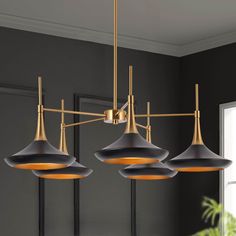 Elevate your home décor with our stunning black and gold chandelier. This contemporary piece is perfect for your kitchen or dining room, adding a touch of sophistication and elegance to any space. With a matte black finish and gold accents, this chandelier is a modern twist on a classic design. The 5 light fixture provides ample lighting for any room. Crafted with high-quality materials, this chandelier is durable and long-lasting. Easy to install, this piece will be the perfect addition to your Modern Gold And Black Chandelier, Black Chandelier Table, Statement Black Chandelier, Dining Room Lights From Lowes, Modern Farmhouse Chandelier Dining Rooms Brass, Black Gold Kitchen Lights, Matte Black Chandelier Dining Room, Round Chandelier Dining Room Black, Black And Brass Kitchen Chandelier