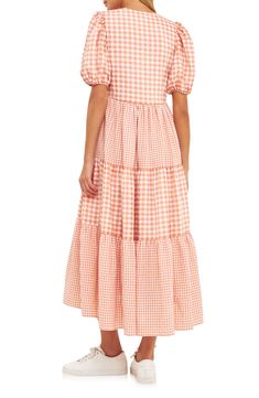 Cheery checks flit and flow across a tiered dress popped with a pair of handy pockets and done in a swingy shape. V-neck Short sleeves Lined 95% polyester, 5% spandex Hand wash, dry flat Imported Summer Gingham Dress With Tiered Skirt, Gingham Tiered Dress For Picnic, Spring Gingham Maxi Dress For Brunch, Summer Gingham Tiered Dress, Summer Tiered Gingham Dress, Tiered Gingham Dresses For Summer, Gingham Midi Dress With Ruffle Hem, Casual Gingham Tiered Dress, Casual Tiered Gingham Dresses