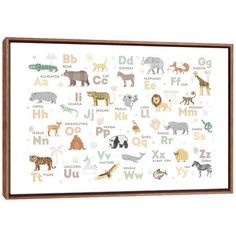 an animal alphabet print on a white wall above a wooden framed art piece with gold trim