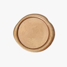 a round wooden object on a white background