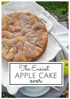 an apple cake with powdered sugar on top and the words, the earliest apple cake ever