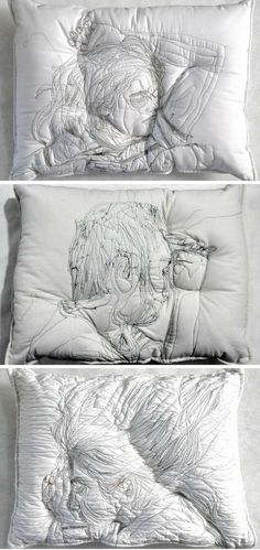 three pillows with drawings on them sitting next to each other