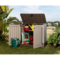 an outdoor storage shed with its doors open and gardening supplies in the bins outside