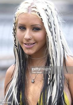 a woman with long white hair and braids