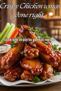 a white plate topped with chicken wings covered in sauce