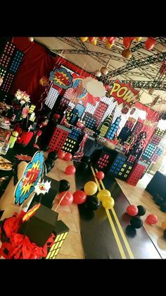 a room filled with lots of decorations and balloons