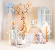 a baby's room with balloons, toys and giraffes