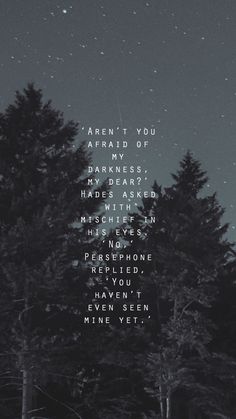 the words are written in black and white on a dark night sky above some trees