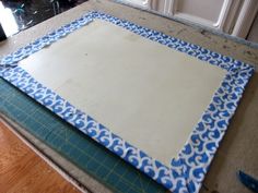 a cutting board with blue and white designs on it