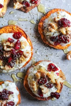 mini sweet potatoes topped with cranberries and nuts