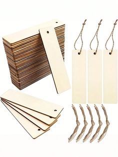 a bunch of wooden tags and some string on a white background with clippings