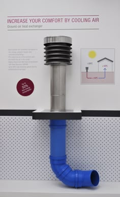 a blue pipe on top of a white shelf next to a sign that says increase your comfort by cooling air