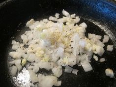 onions being cooked in a skillet on the stove