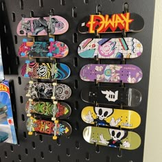 there are many skateboards hanging on the wall