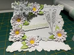 a close up of a card with flowers on it