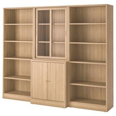 a wooden bookcase with glass doors and shelves