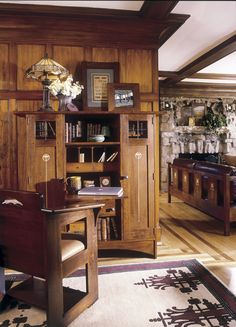 a wooden desk and chair in a room