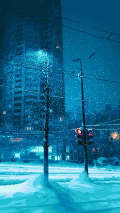 a stop light in the middle of a snowy city at night with snow falling all around