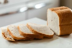 slices of white bread sitting on top of a counter