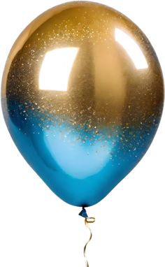 a blue and gold balloon floating in the air