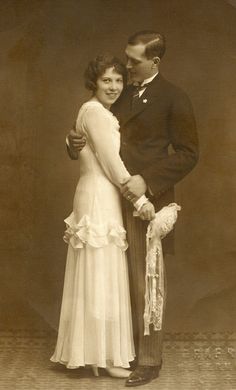 an old photo of a man and woman