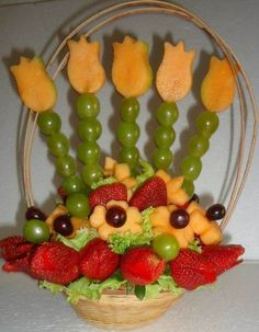 a basket filled with fruits and veggies on top of a table