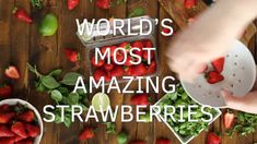 the words world's most amazing amazing strawberries are displayed on a wooden table