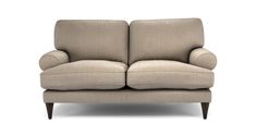 a beige couch with two arms and one arm extended to the side, on a white background