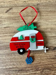 an ornament shaped like a camper with a christmas tree on top