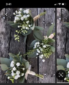 two bouquets of flowers are sitting on a wooden table with leaves and stems attached to them