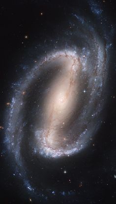 an image of a spiral galaxy in the night sky, taken from space with no one around it