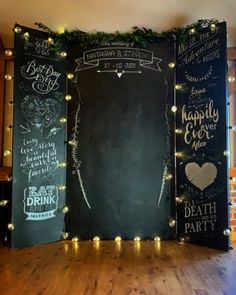 three chalkboard boards with lights on them