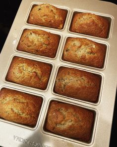 twelve freshly baked muffins sitting in a pan