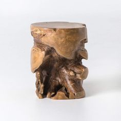 a piece of wood that has been carved to look like an animal's head