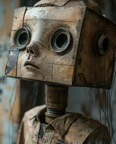 a wooden robot with two eyes and no head