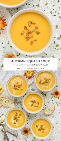 four bowls filled with pumpkin soup on top of a table