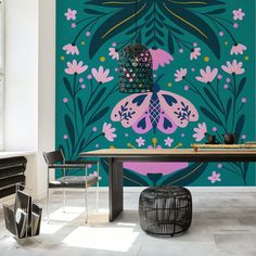 a dining room table with chairs and a large wall mural in the background that has pink flowers on it