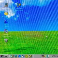 a computer screen with windows on it and some clouds in the sky behind it,