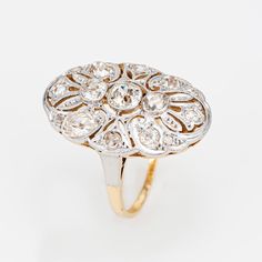 This is part of Chairish’s Fine Jewelry assortment.  Finely detailed antique Art Nouveau diamond ring (circa 1910s) crafted in 18k yellow gold & 900 platinum.   Old mine & rose cut diamonds total an estimated at 1 carat (estimated at K-L color and SI2-I2 clarity).    The beautiful platinum topped Edwardian era ring is set with glimmering old mine and rose cut diamonds. With fine mile grain detail the oval shaped mount is larger in scale (approx. 1 x 1/2 inch) and makes a nice statement on the ha Heirloom Style Oval Diamond Ring With 17 Jewels, Heirloom Oval Diamond Ring With 17 Jewels, Antique Oval Hallmarked Diamond Ring, Art Deco Oval Diamond Ring With Brilliant Cut, Oval Art Deco Hallmarked Diamond Ring, Art Deco Oval Rings With Rose Cut Diamonds, Antique Oval Diamond Ring With Center Stone, Antique Oval Brilliant Cut Ring, Antique Platinum Yellow Gold Rings