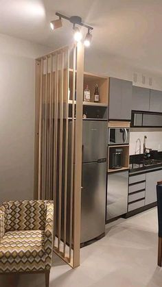 a kitchen and dining room with stainless steel appliances